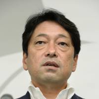 Osprey briefing: Defense Minister Itsunori Onodera speaks to reporters Friday in Tokyo. | KYODO