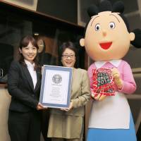 Voice behind the toon: Midori Kato (center), the voice actress who has been playing the title character in \"Sazae-san\" since 1969, takes part in a Guinness World Records ceremony Thursday in Shinjuku Ward, Tokyo. | KYODO