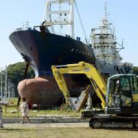 Shore duty over: Work begins Monday to dismantle the Kyotoku Maru No. 18, a fishing vessel that was washed ashore by the March 2011 tsunami. | KYODO