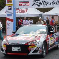 Pep rally: Racing buffs check out the car that was driven by Toyota Motor Corp. President Akio Toyoda during the Toyota Racing Development Rally Challenge in Shibukawa, Gunma Prefecture. | KYODO