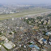 No-fly zone: U.S. Yokota Air Base, situated near the city of Fussa in western Tokyo, is seen in 2009. | KYODO