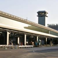 Walk this way: New moving walkways at Narita International Airport that connect Terminal 2 and an annex will begin service next Friday, replacing the highly unpopular bus service. | KYODO