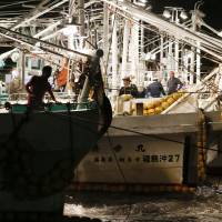 Heading out: Fishermen in Fukushima Prefecture leave the port of Matsukawaura on Wednesday, resuming trial operations that were suspended by radioactive water leaking from the No. 1 nuclear plant into the sea. | KYODO