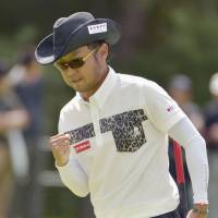 Flying start: Shingo Katayama celebrates after sinking a birdie on the 18th hole at the Asia-Pacific Panasonic Open on Thursday. | KYODO