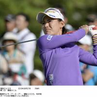 On target: Sakura Yokomine hits a shot during the first round of the Miyagi TV Cup on Friday. Yokomine is tied with Ai Miyazato and one other for the lead. | KYODO