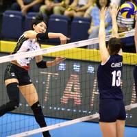 Strong return: Japan\'s Yuki Ishii spikes the ball against Australia in an Asian qualifying match for the 2014 FIVB World Championships at Park Arena Komaki on Saturday. Japan beat Australia in straight sets. | KYODO