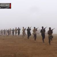 Training day: Suspected militants train in Iraq near the Syrian border. Islamists from extremist groups such as Jabhat al-Nusra and the Islamic State of Iraq and the Levant have been abandoning local headquarters in Syria and moving military equipment ahead of possible U.S. strikes on the regime. | AP