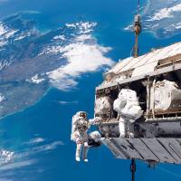 Spaced out: Astronauts Robert Curbeam of the United States and Christer Fuglesang  of Sweden work to attach a new truss segment to the International Space Station and begin an upgrade to the power grid in December 2006. | ASTRONAUTS TAPPED FOR SERVICE ON THE ISS TRAIN UNDER WATER THE WASHINGTON POST