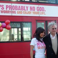 Secular slogan : Richard Dawkins and campaign organizer Ariane Sherine pose in front of a bus featuring an atheist advertisement stating, \"There\'s probably no God. Now stop worrying and enjoy your life,\" in London on Jan. 6, 2009. The advertisement supported a campaign that was a response to evangelical Christian advertisements running on buses in June 2008. | ZOE MARGOLIS