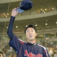 First timer: Swallows pitcher Kenichi Matsuoka waves to the crowd after throwing a shutout against the Giants on Wednesday.  | KYODO