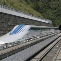 All aboard:  The L0 (L-zero) series magnetic-levitation train, developed by Central Japan Railway Co., sits parked on a test track at the control center before a trial run in Tsuru, Yamanashi Prefecture, in August, 2013. | BLOOMBERG