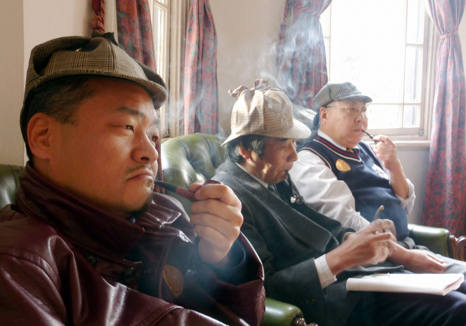 Not the Japan  Writers Conference: Men puff on pipes as they imitate Sherlock Holmes at the English House in Kobe's historic Kitano Ijinkai district of former foreign residences in 2010. One Japan-based author advises new writers to heed the words of Arthur Conan Doyle's detective if they want to succeed in the world of publishing. | KYODO