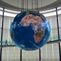 Earth rising: The “Tsunagari” exhibit uses weather-satellite data to show how our planet looks from space. Take the kids to the future at Miraikan