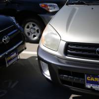 Kicks the tires: Toyota models are for sale at a CarMax used-car dealer in Lexington, Kentucky, on Sept. 23. | BLOOMBERG