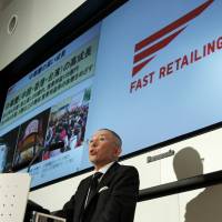 On the up and up: Fast Retailing Co. chief Tadashi Yanai annouces the firm, which operates the Uniqlo casual clothing chain, posted record net sales of &#165;1.143 trillion in the last business year on rapid growth in Asia, at a Thursday news conference in Tokyo. | BLOOMBERG