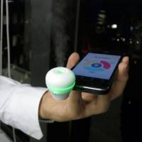 Nose for business: A scent is emitted from the Scentee cellphone attachment created by Tokyo-based Scentee Inc. The product will debut Nov. 15. | KAZUAKI NAGATA