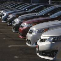 Turnkey: New Camry and Avalon models sit in the DCH Auto Group Toyota Dealership lot in Torrance, California, in July. Camry loses Consumer Reports nod