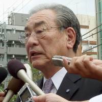 Fish wish: Hiroshi Kishi, head of JF Zengyoren, faces reporters Tuesday outside the South Korean Embassy in Tokyo. | KYODO