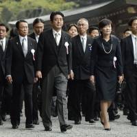 Shinto rounds: Prime Minister Shinzo Abe and his wife, Akie, visit Ise Shrine in Mie Prefecture on Wednesday to attend the Shikinen Sengu ceremony, during which enshrined objects are transferred to new Inner and Outer shrine buildings every 20 years. | KYODO