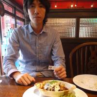 Payment in kind: Koichiro Tawa, co-founder of IT startup Timers, has lunch at a pub in Roppongi, Tokyo, using one of the coupons his company received in exchange for creating the establishment’s website. IT startup barters its way into niche
