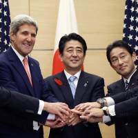 Unified security: Prime Minister Shinzo Abe (center) poses with U.S. Defense Secretary Chuck Hagel (left), U.S. Secretary of State John Kerry (second from left), Foreign Minister Fumio Kishida (second from right) and Defense Minister Itsunori Onodera during a meeting at the Prime Minister’s official residence in Tokyo on Thursday. U.S., Japan to update defense rules in 2014