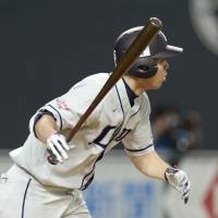 Mind the gap: Seibu\'s Shogo Akiyama hits a two-run single in the seventh inning of the Lions\' 4-3 win over the Fighters on Sunday. | KYODO