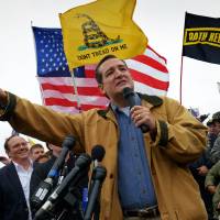 Rallying around: Texas Republican Sen. Ted Cruz makes remarks as veterans, their families and supporters hold a rally Sunday at the World War II Memorial in Washington to protest its closing. | THE WASHINGTON POST