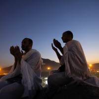 Trouble in Jannah: Muslim pilgrims pray on the Mountain of Mercy, near the holy city of Mecca, in Saudi Arabia on Oct. 14. Saudi Arabia recently refused a coveted seat at the U.N. Security Council as a show of public protest against the United States, its long-time ally | AP