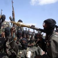 Urban warfare: Al-Shabab fighters prepare to enter Mogadishu to attack Ethiopian troops aiding Somalia in December 2008. | AP
