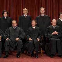 The bench: The nine members of the Supreme Court pose for a group photograph to reflect their newest member, Elena Kagan, in October 2010 in Washington. Front row, from left: Clarence Thomas, Antonin Scalia, John Roberts, Anthony Kennedy, Ruth Bader Ginsburg. Back row, from left: Sonia Sotomayor, Stephen Breyer, Samuel Alito, Elena Kagan. | THE WASHINGTON POST