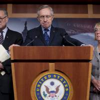Last hope: Senate Majority Leader Sen. Harry Reid gives a news conference with Sen. Chuck Schumer (left) and Sen. Patty Murray on Capitol Hill on Saturday. | AP