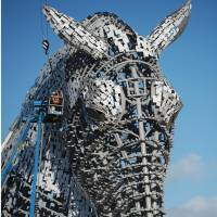 One of two sculptures called the Kelpies stands at the Forth and Clyde canal\'s eastern entrance in Falkirk, Scotland. Sculptor Andy Scott designed the 30-meter heads, part of the Helix development project, as a monument to the horse-powered past. | GETTY/KYODO