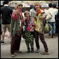 Keeping it in the family: A photo from \'366 Portraits\' captures Nobu (driver, 37), Akira (10) and Chie (cook, 37). \'Well, when you go to the Jamaican festival, you should dress for the occasion, right?\' photographer Cedric Riveau explains. \'The three of them were so friendly and interested in my project that we talked for about 30 minutes together. As soon as they finish their work, they put on their favorite clothes and listen to reggae. More than a lifestyle — a philosophy.\" | CEDRIC RIVEAU