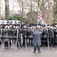 Brit in their midst: A lone loyalist carrying the Union Jack faces Royal Ulster Constabulary officers on the road leading to Stormont, near Belfast, in 1985. Briton Tim Burt was detained by the RUC in the 1980s and by Tokyo’s finest 30 years later. The irritating <em>gaijin</em>: testing police patience from Belfast to Oimachi