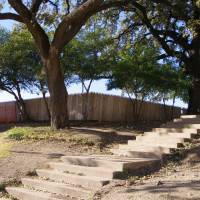 Second shooter?: The picket fence atop the grassy knoll on Elm Street in Dallas, as it appears today. Conspiracy theorists believe a sniper fired from behind the fence and, when confronted by bystanders, he and a confederate flashed ID identifying them as Secret Service agents. | MARK SCHREIBER