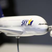 A matter of financing: A model of a Skymark Airlines Inc. Airbus A380 sits on display during a news conference at the Paris Air Show in June 2011. | BLOOMBERG