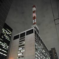 Watts up: It\'s business as usual at Tokyo Electric Power Co. headquarters Thursday night. | AFP-JIJI