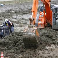 Funded by you: Decontamination work continues in Kawamata, Fukushima Prefecture, on Thursday. The government is planning to use in excess of &#165;1 trillion in public funds for efforts to clean up contaminated areas around the wrecked Fukushima No. 1 nuclear plant. | KYODO