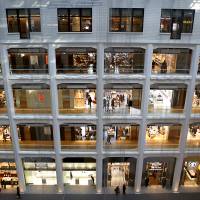 Whac-A-Mole: Shoppers browse around a shopping mall in Tokyo on Wednesday. Prime Minister Shinzo Abe’s structural reform drive faces resistance from a range of vested interests Abe's 'third arrow' of structural reform being deflected by vested interests