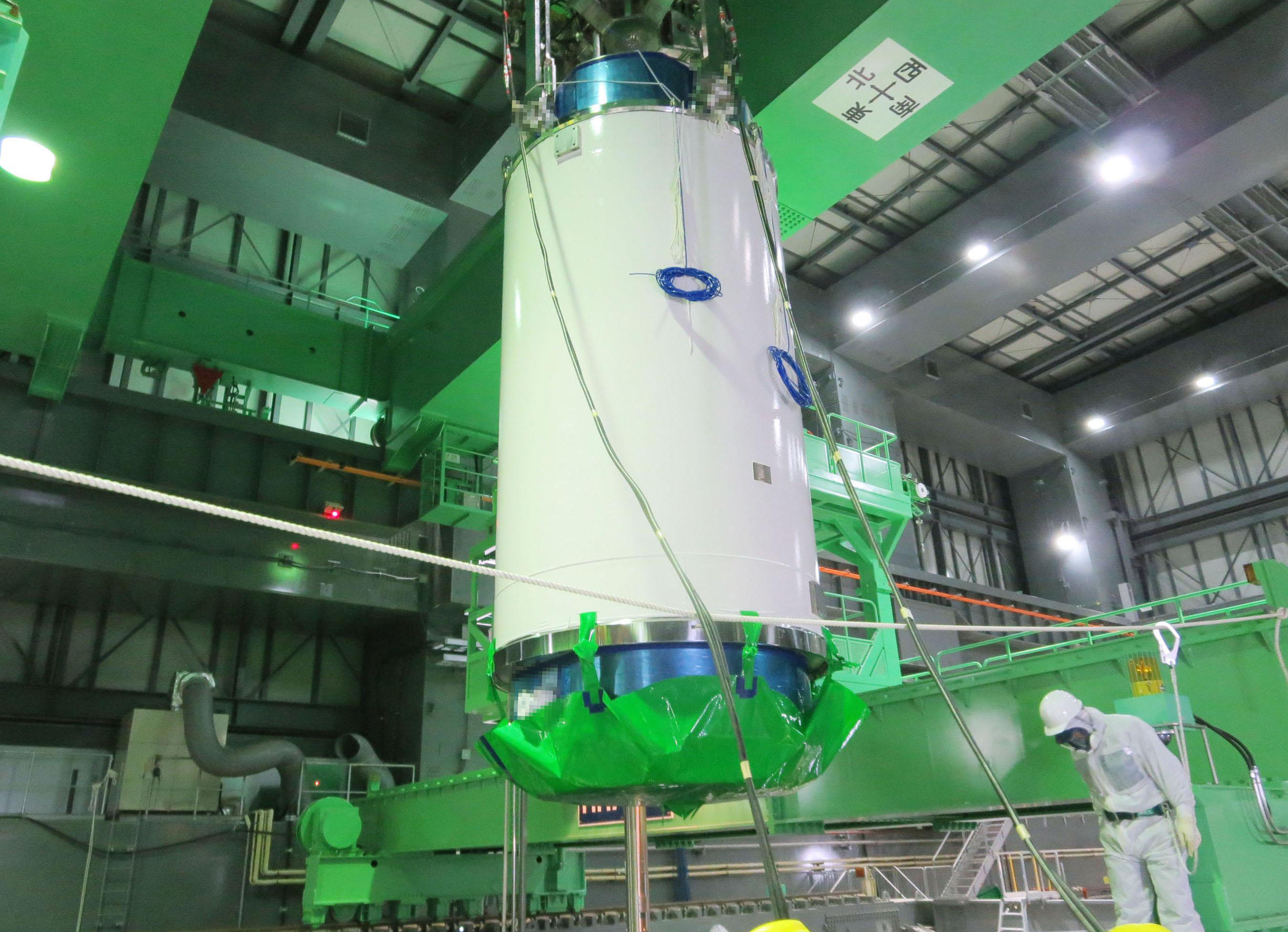 Risky business: A special transport cask for removing nuclear fuel assemblies is moved inside the building housing reactor 4 at the Fukushima No. 1 power plant Monday. | TEPCO/KYODO