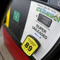 What\'s the solution?: A motorist fills up with gasoline containing ethanol in Des Moines, Iowa | AP