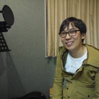 Aiming high: Inhyeok Yeo sits in a recording studio in Tokyo. The 26-year-old singer has set his sights on winning a Grammy Award. | TOMOKO OTAKE