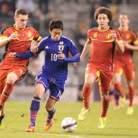 Big game hunter: Shinji Kagawa looked close to his best against the Netherlands and Belgium after a slow start to the Premier League season with Manchester United. Belgian tour provides welcome tonic for Japan