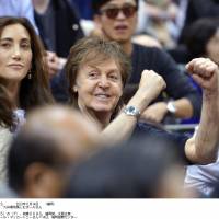 Get him: Paul McCartney takes in the action on the fifth day of the Kyushu Grand Sumo Tournament on Thursday in Fukuoka. | KYODO