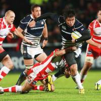 Learning curve: Japan\'s Shinya Makabe is tackled by Gloucester\'s Andy Hazell during the English team\'s 40-5 win at Kingsholm Stadium on Tuesday | AP