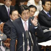 Ante upped: Prime Minister Shinzo Abe fields questions Monday at the Upper House Budget Committee regarding China\'s creation of an air defense identification zone that covers airspace over the Senkaku Islands. | KYODO