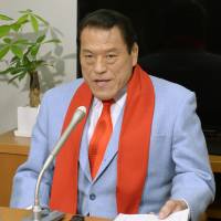 Tag-teamed: Upper House member Antonio Inoki faces reporters Friday in his office in Tokyo after he was banned from attending Diet sessions for 30 days. | KYODO