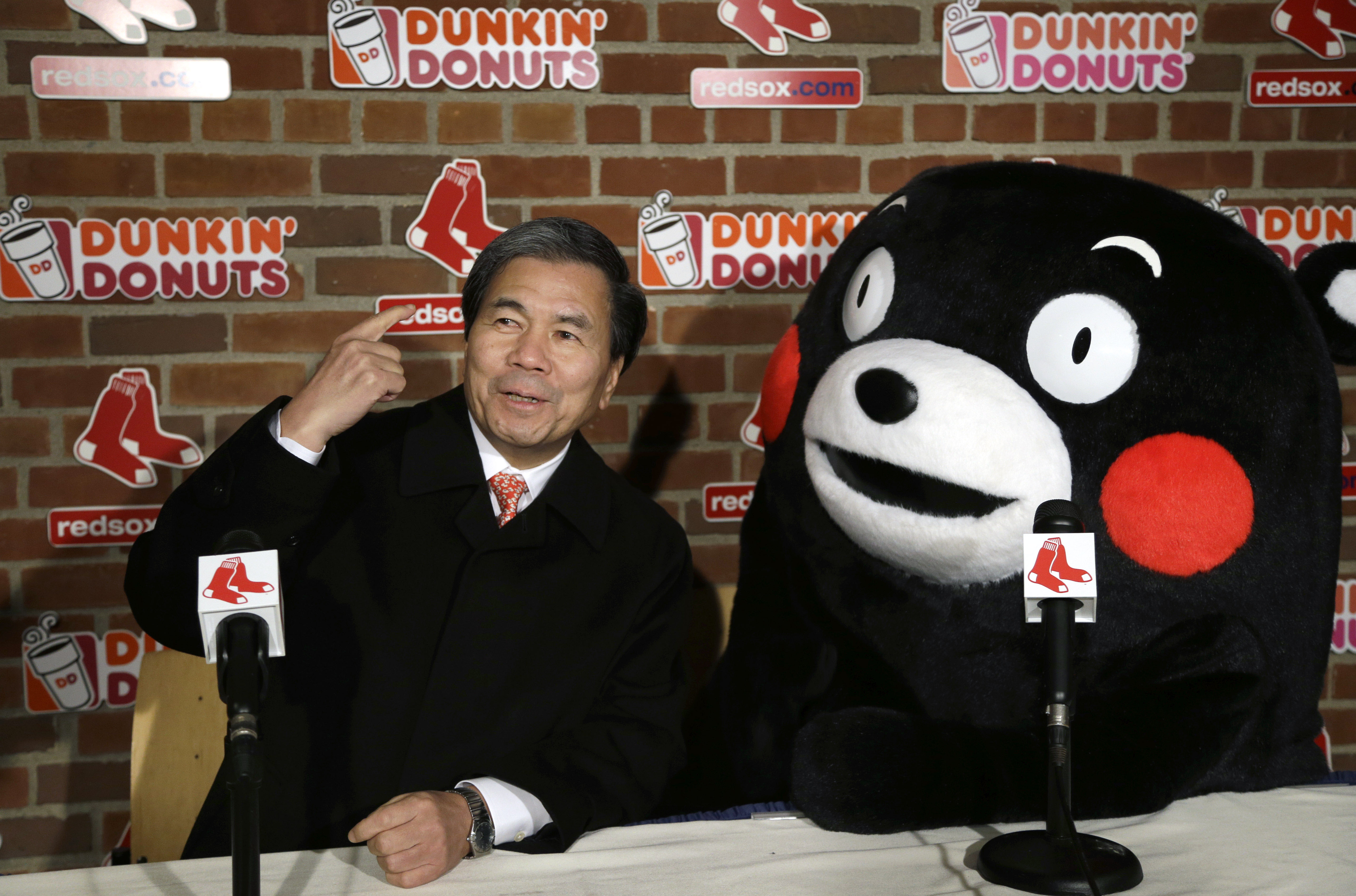 Heavy hitters: Kumamoto Gov. Ikuo Kabashima and Kumamon, the prefecture's popular black bear 'yuru-kyara' mascot, field questions from members of the media during a visit to Fenway Park, home of the Boston Red Sox baseball team, Tuesday | AP