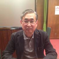 Realist: Kazuhito Ikeo, professor of economics at Keio University, is interviewed at his Tokyo office earlier this month | REIJI YOSHIDA