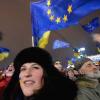 EU boosters: Ukrainians shout \"Sign on!\" during a rally for an accord with the EU in Kiev on Thursday. | AFP-JIJI